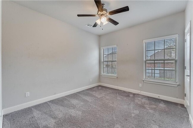 Building Photo - Minutes from I-49! 4BR/2.5BA Home