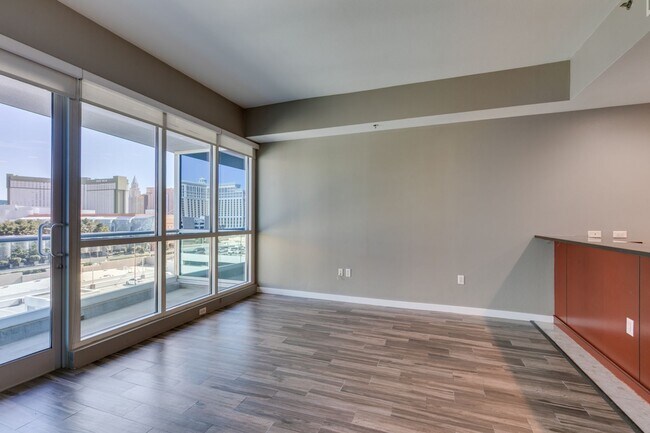 Building Photo - Iconic Strip-View Luxury | Elegant 1BR + Den High-Rise Residence