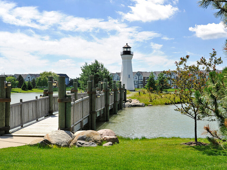 Lake with Lighthouse and Bridge - The Harbours Apartments