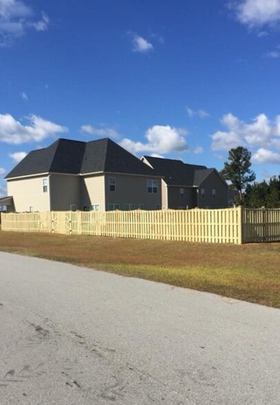 back side of home - 100 Pine Lakes Drive