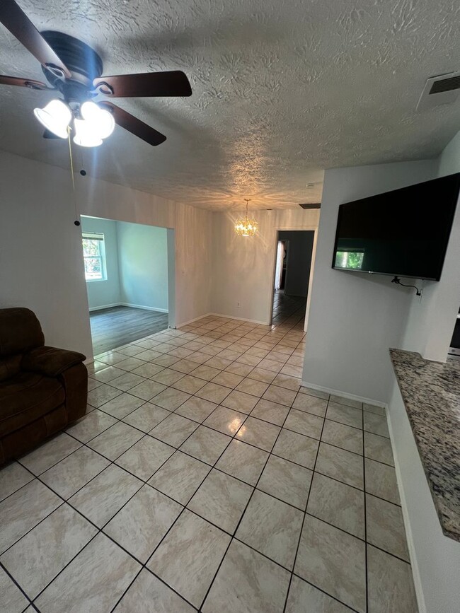 Building Photo - 3 BEDROOM 2 BATH CONVENIENTLY LOCATED WITH A TROPICAL OASIS IN THE BACK YARD!