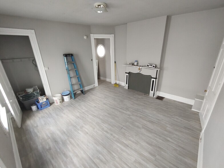 Living Room: 15x15. New floors - 208 E 9th St
