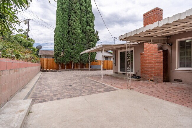 Building Photo - Charming Updated Home With Drive-Through Garage Access