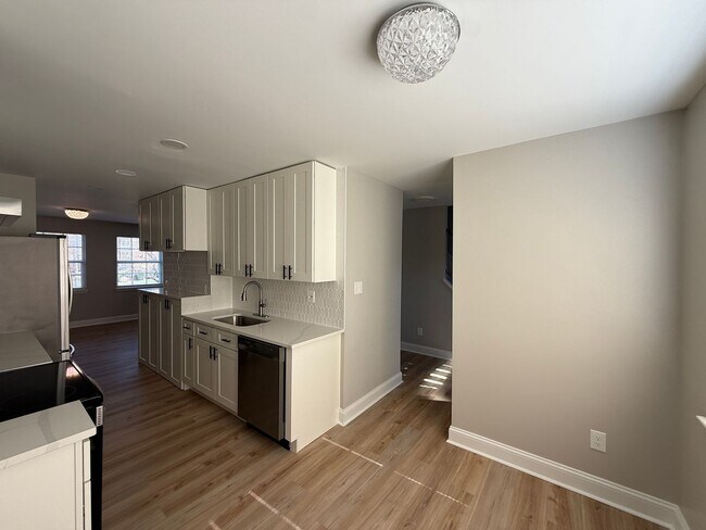 Building Photo - New Everything 4BR Townhome with Private Lower Level Suite | Stainless Kitchen | LVP + New Carpet...