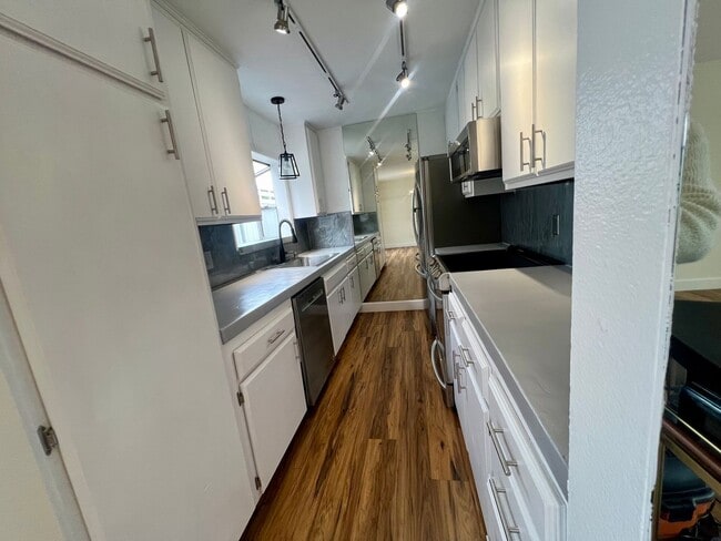 Building Photo - TWO PARKING SPACES INCLUDED! In Unit Washer & Dryer! Large Private Patio for Bikes, Boards and Bb...