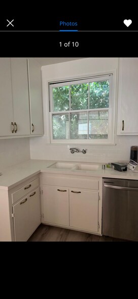Kitchen with Quartz countertops and stainless steel appliances - 4411 Ensign Ave