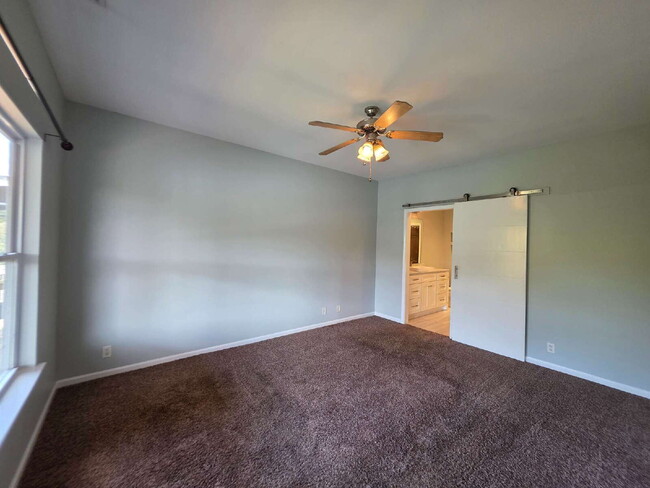 Building Photo - Lakefront 3BR/3BA with Covered Deck, Garage & Community Pool