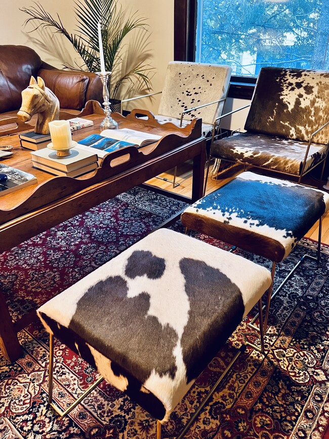 Cowhide accent chairs and pieces. - 2424 Stevens Ave