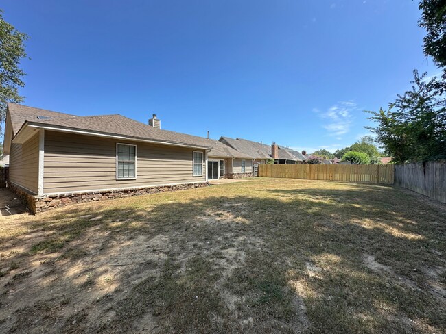 Building Photo - Grand 4BR/2BA Near Southwind | 2,438 Sq Ft, Stone Fireplace, Soaking Tub & 2-Car Garage