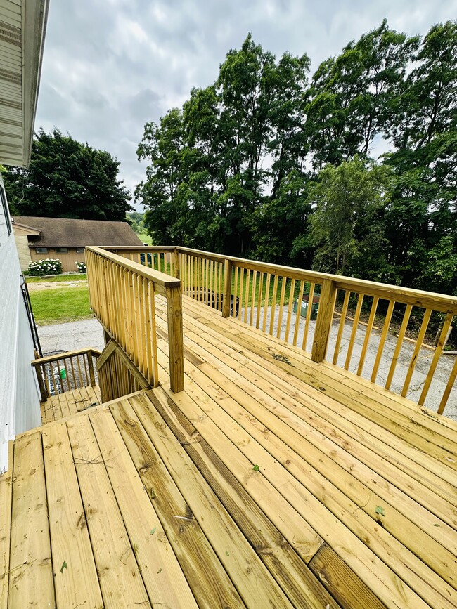 Apartment 1 private deck and entrance - 410 Pine Lake Ave