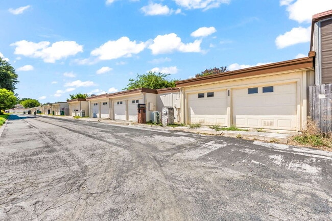Building Photo - "Charming garden home offers 3-Bedroom Sanctuary with Cozy Fireplace in San Antonio – 1710 Sq Ft ...