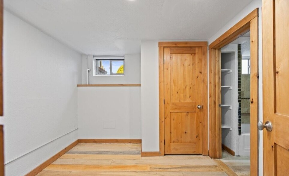 Built-in shelves in bathroom for extra storage - 5014 W 36th Ave