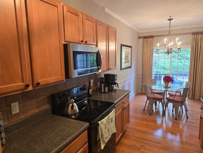 Building Photo - Beautiful Apex Townhome with Greenway Access & Community Amenities