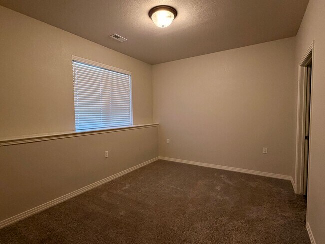 Building Photo - Move-In Ready 3-Story Townhome with Loft & 2-Car Garage