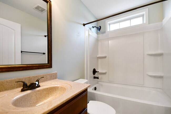 Building Photo - Pet Friendly Three Bedroom with Bonus!