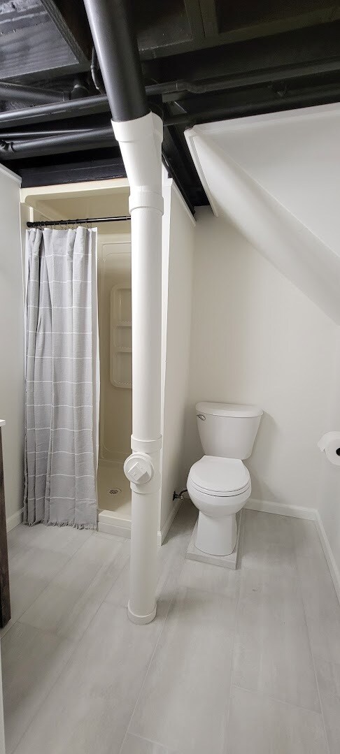 Basement Bathroom includes Shower, new tile, new toilet, new light fixtures, new vanity, new faucet, - 6305 49th Ave