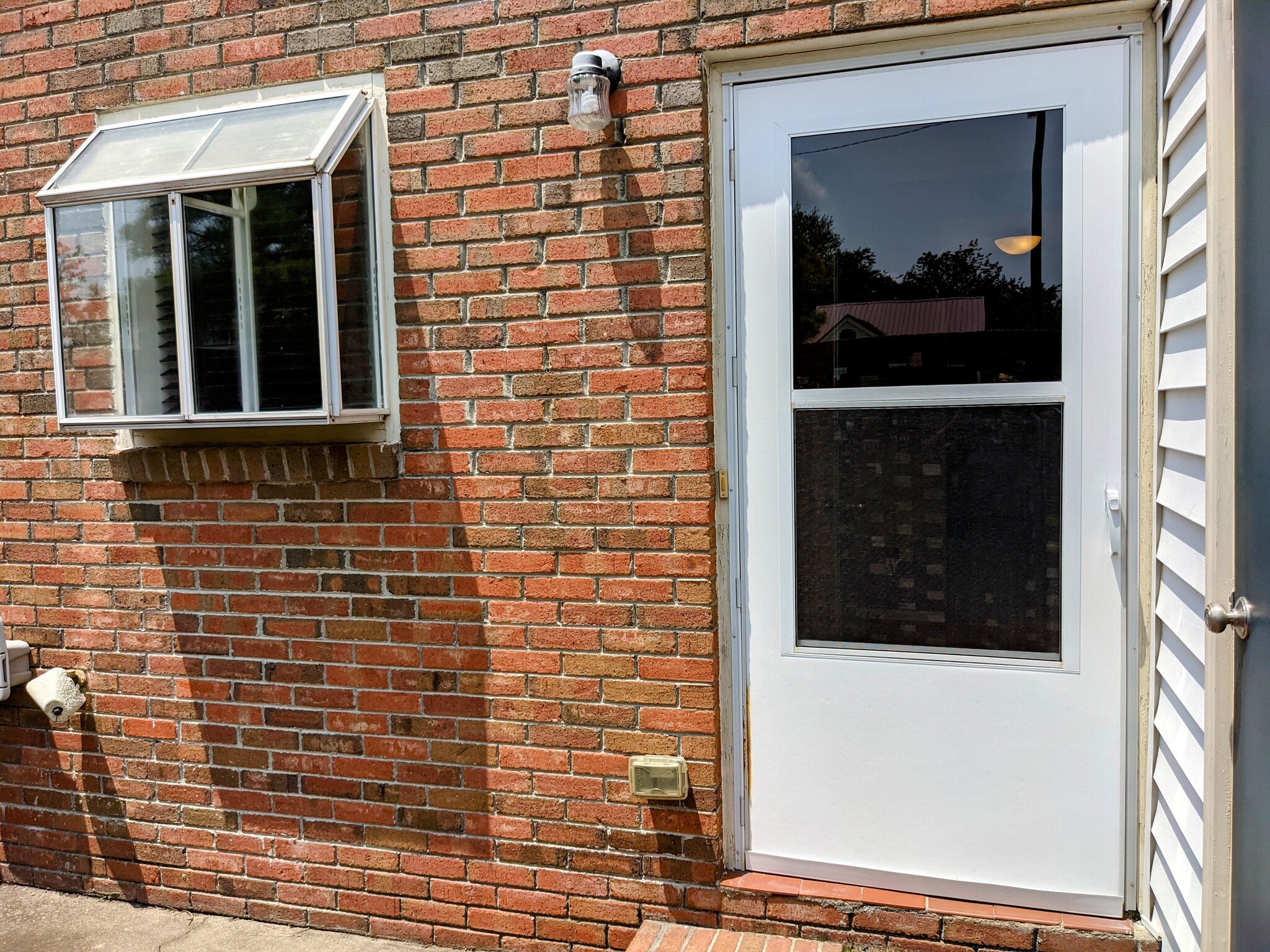 Back Door to Patio with kitchen window - 940 Glenn St