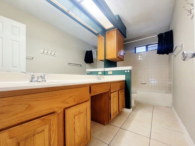 Building Photo - Warm & Inviting 4BR / 2.5BA Home with Covered Deck and 2-Car Garage