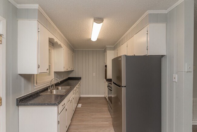 Building Photo - Freshly Updated 3BR with New LVP Flooring, Energy-Efficient Windows & Spacious Fenced Backyard