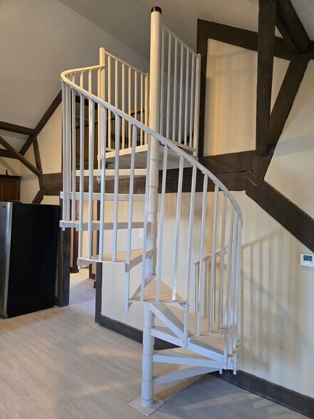Spiral staircase leading to loft bedroom on 3rd floor. - 60 W Winter St