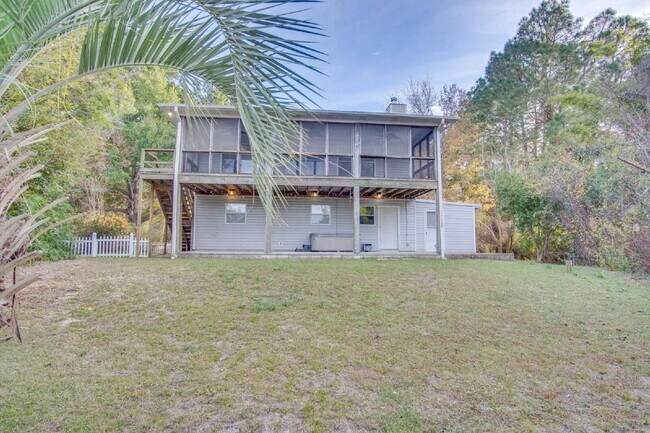 Building Photo - Live the Gulf Breeze Waterfront Life – Dock, Canal Access & Boat Lift!