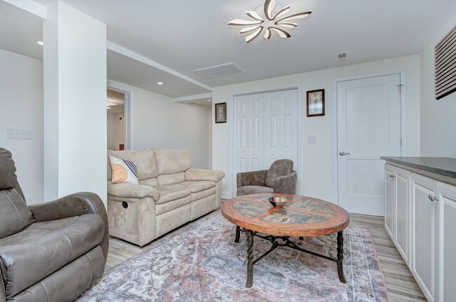Building Photo - Discover the charm of this FULLY FURNISHED basement unit, tucked away in a beautifully updated bu...
