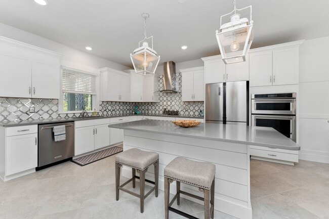 Building Photo - Introducing a captivating 3-story townhome...