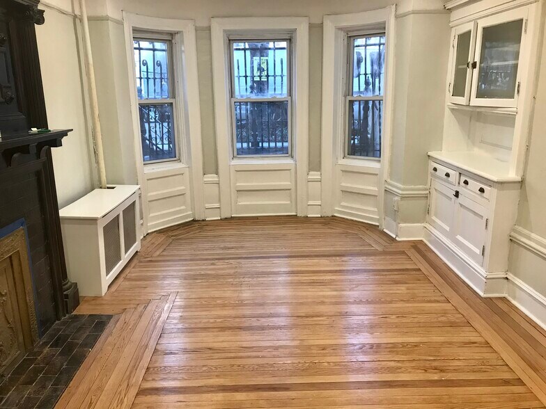 Iiving space with fireplace and built in cabinets - 1061 Clay Ave