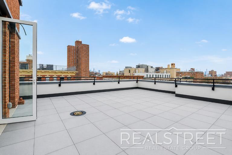 Building Photo - Sun-Filled Penthouse Duplex with Massive Private Terrace & Bonus Storage Room