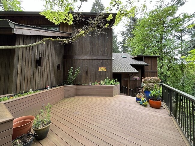 Building Photo - One-of-a-Kind Custom Home with Wall of Windows, Stone Fireplaces, Expansive Entertainment Space &...