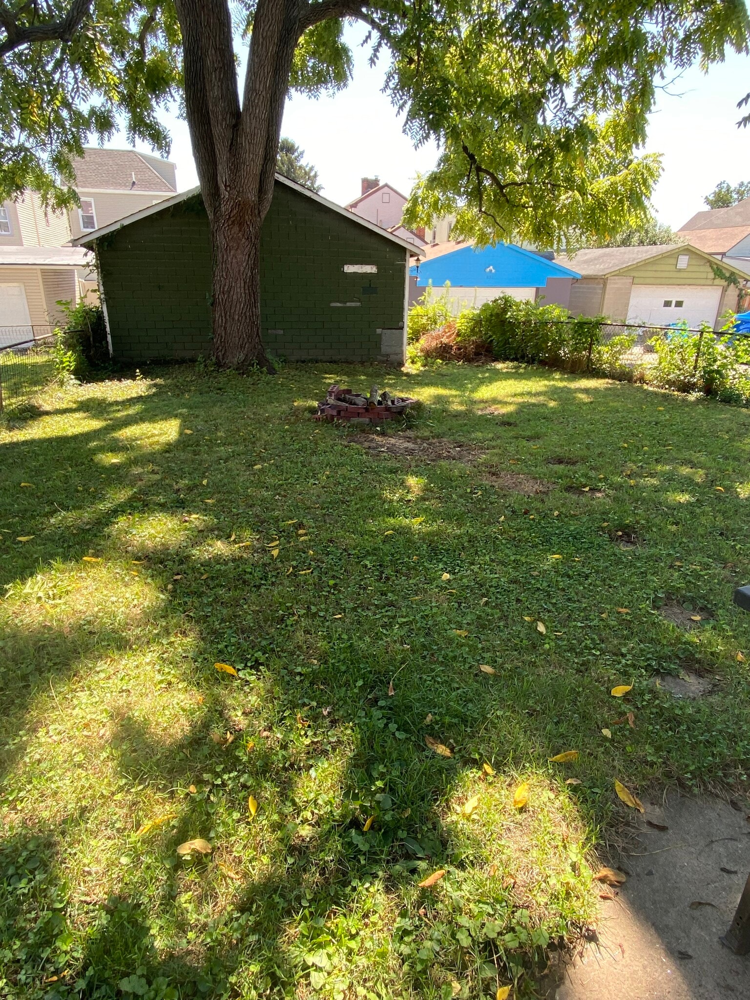 Fenced-in yard. Garage available for small storage. - 224 Walnut St