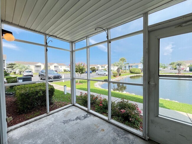 Building Photo - First Floor, Unfurnished, 3 Bedroom, 2 Bath Condo with Screened-in Back Patio!