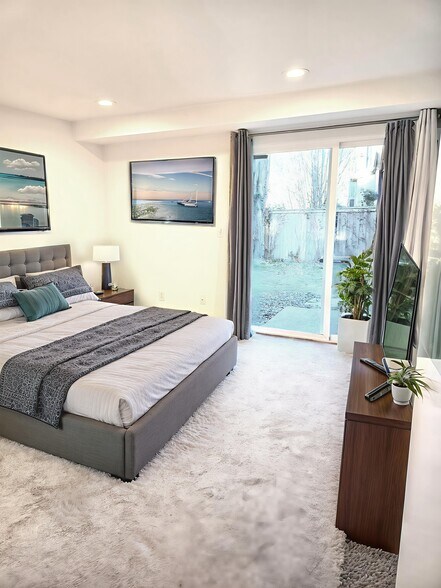 Primary Bedroom with Slider Doors to backyard patio - 9906 NE 124th St