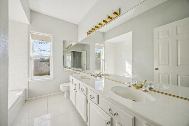 Building Photo - "Coming Soon! Spacious 4-Bedroom, 2.5-Bath Living Meets Storybook Backyard Charm!"