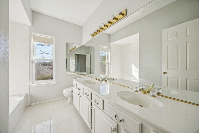 Building Photo - "Spacious 4-Bedroom, 2.5-Bath Living Meets Storybook Backyard Charm!"