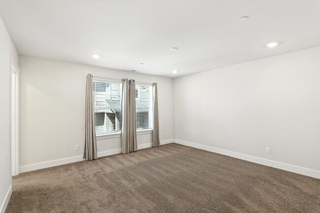 Building Photo - Spacious 4-Bedroom Home, Plus Den/Office with Modern Upgrades and Great Amenities
