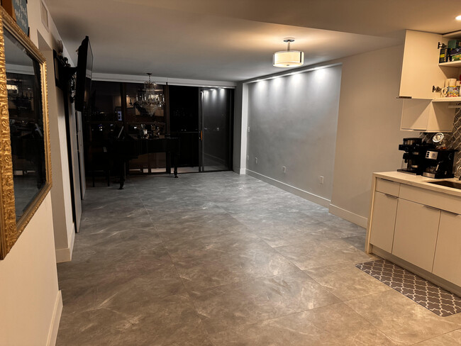 View from the Kitchen to the Dining area and Living Room to the Balcony. - 600 NE 36th St