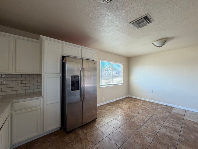 Building Photo - 3 Bedroom 2 Bathroom House with Central A/C , 2 Car Garage and Beautiful Backyard with Covered Patio