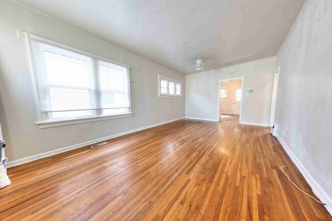 Building Photo - Available Aug 7th - Very nice single family home with refinished hardwood and a very large open l...