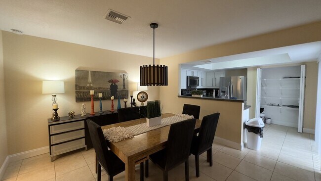 Building Photo - Spacious Wellington End-Unit Townhome | 2 Primary Suites | Screened Patio