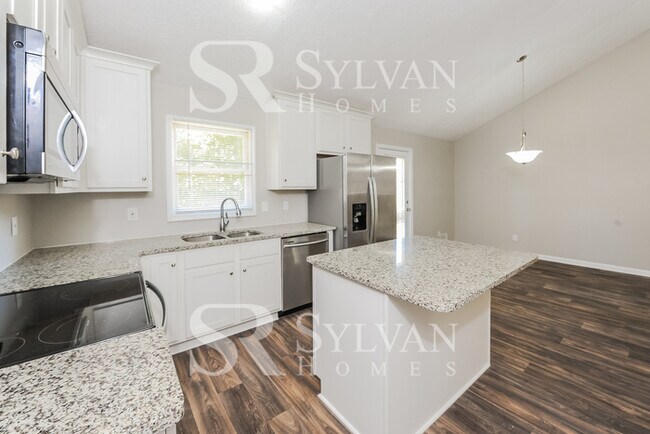Building Photo - Welcome to this charming abode.