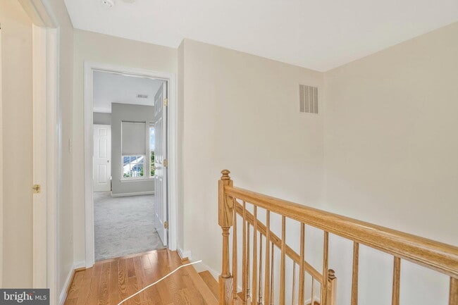 Building Photo - This beautifully maintained brick-front, three-level townhome is located in a highly sought-after...