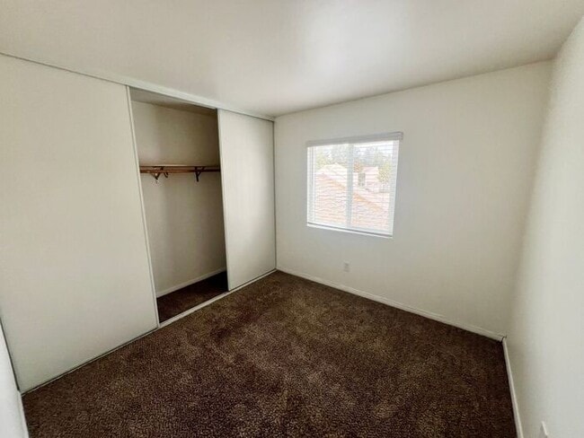 Building Photo - Stunning 4BR Townhome with Hardwood Floors, Private Patio, Community Pool & 2-Car Garage!