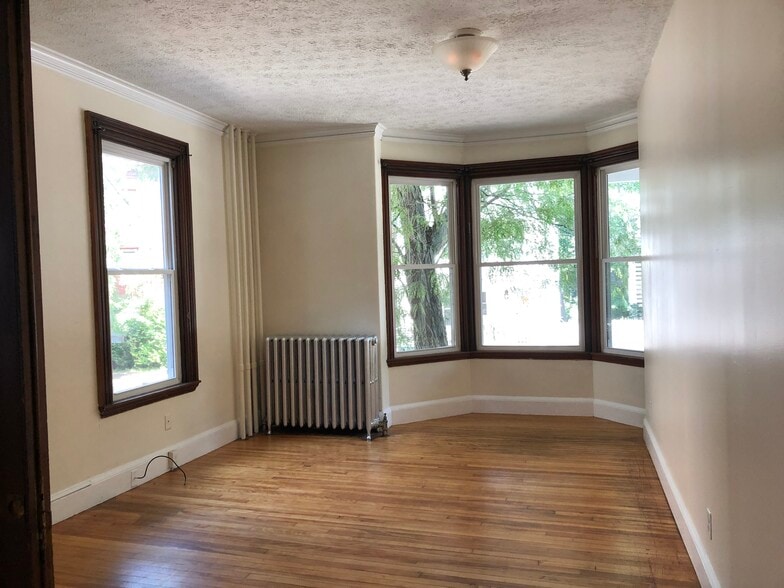 bright living room with bay windows - 20 Grant St