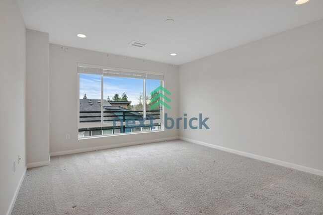 Building Photo - A Beautiful Corner Home Designed for Comfort, Light & Community!