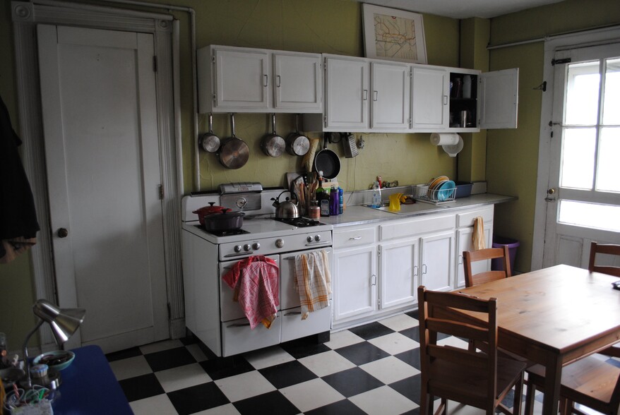 Kitchen and door to bedroom 1 - 204 Wooster St