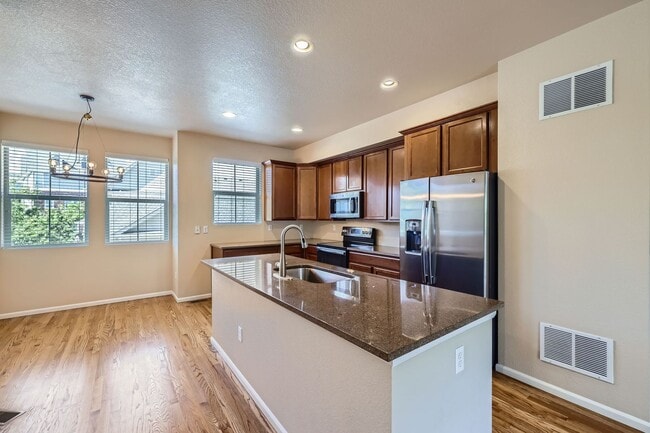 Building Photo - Evolve Real Estate: Available Immediately!...