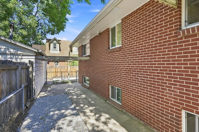 Building Photo - AVAILABLE NOW  Spacious 4-Bedroom Wheat Ridge Home with Finished Garden Level, Two-Car Garage & B...