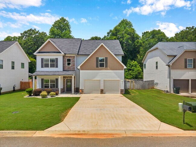 Building Photo - Spacious 4BR Home with Fenced Yard & Community Pool