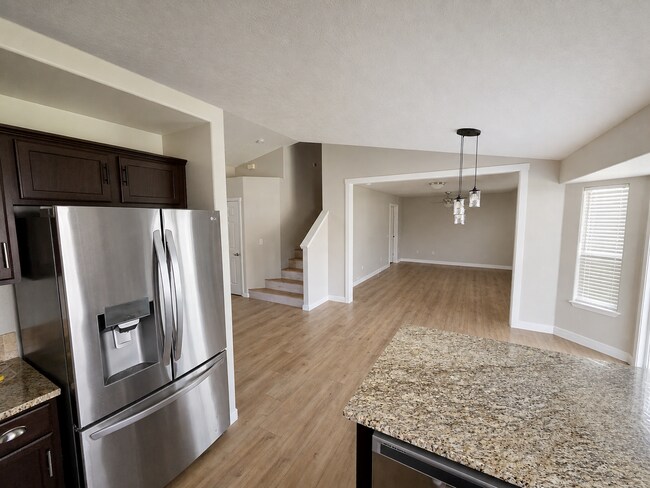 Building Photo - Spacious Home with 3-Car Garage, Two Living Areas & Covered Patio